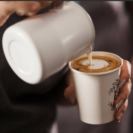 Gillian McIntyre – Latte Art Training Gillian McIntyre pouring steamed milk to create heart-shaped latte art