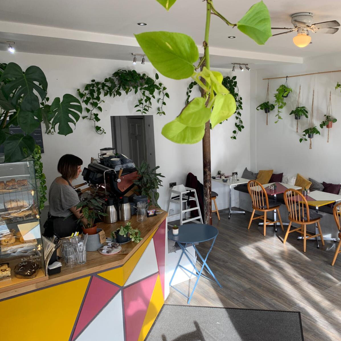 Interior of MAYZE Cafe showing the coffee bar and espresso machine